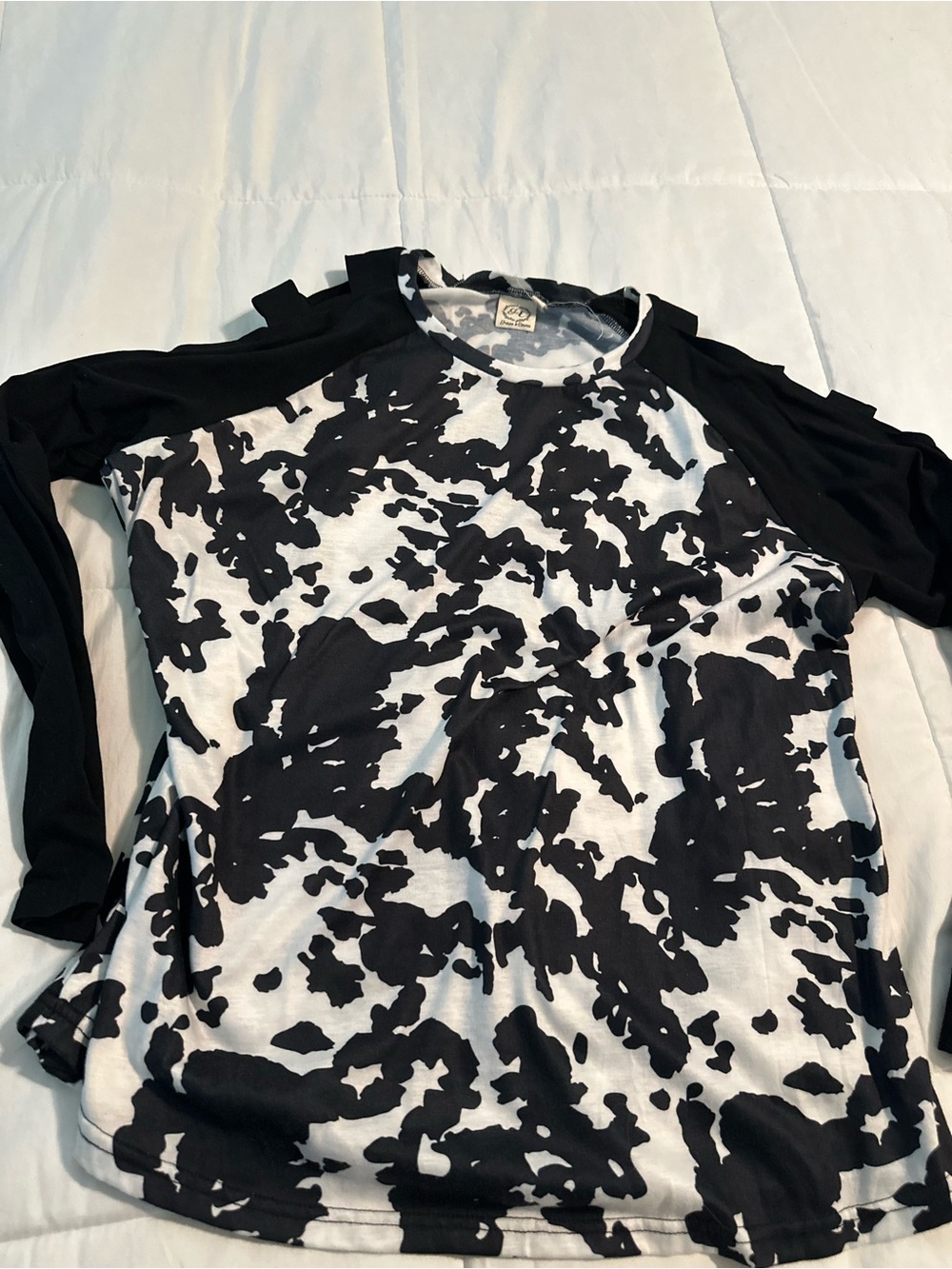 Cow Print, long sleeve with cold shoulder cut outs.